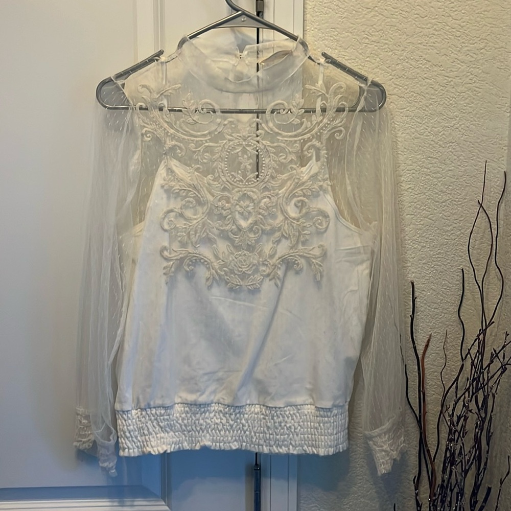 Beautiful cream blouse for play or business